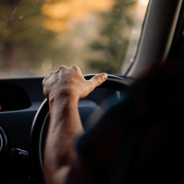 Image of person driving. Offset Individual Car Emissions With Carbon Positive Australia.