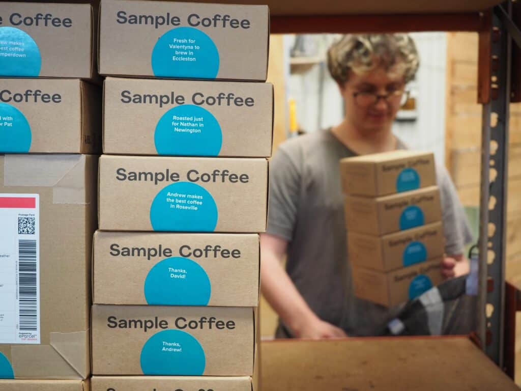 Employee from Sample Coffee Co. in storage room