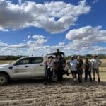 Group photo of planting team next to a ute.