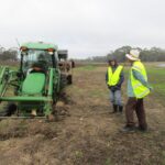 Planting tractor bogged in wet ground