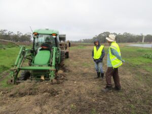 Planting tractor bogged in wet ground