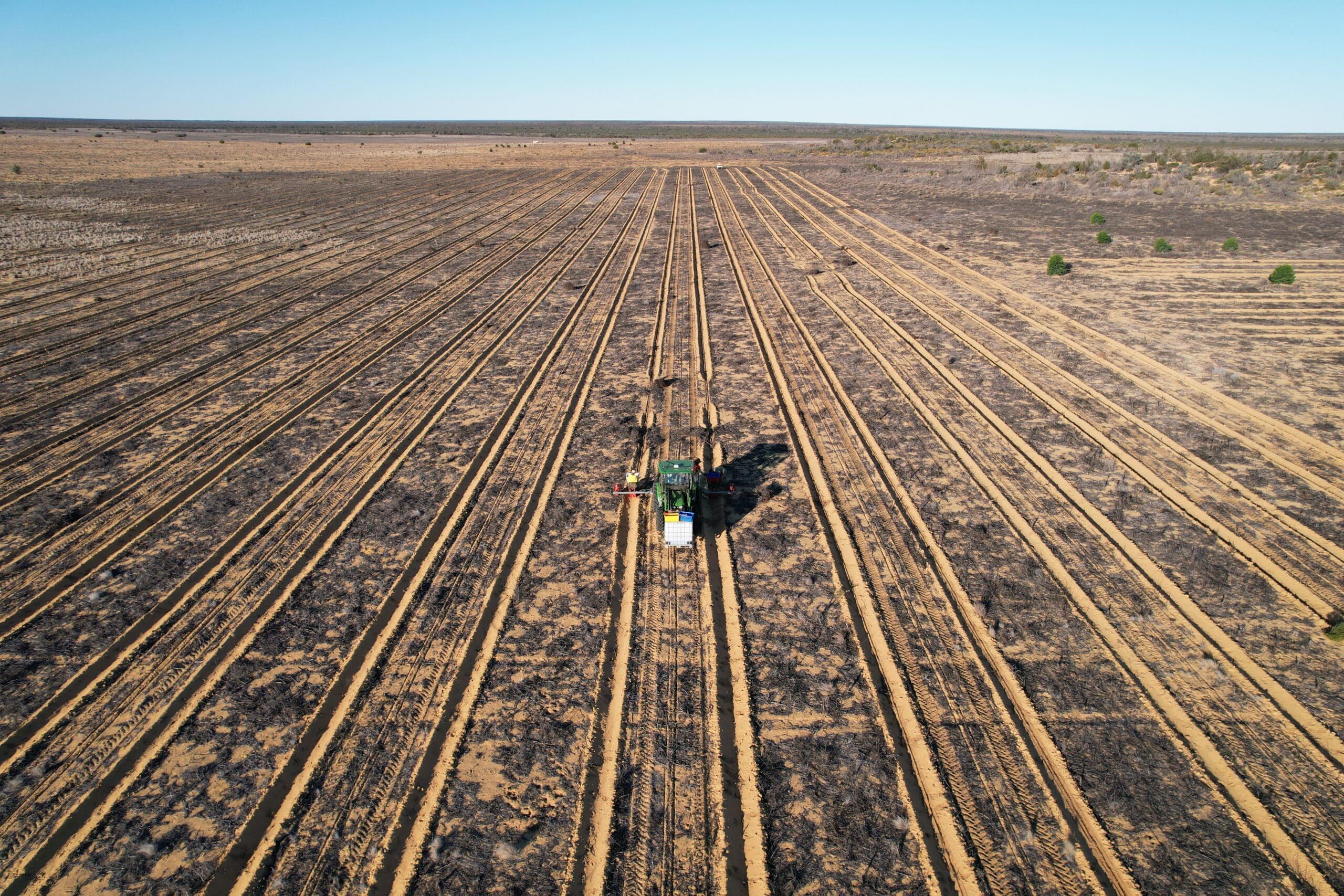 drone shots of planting tractor in planting rows